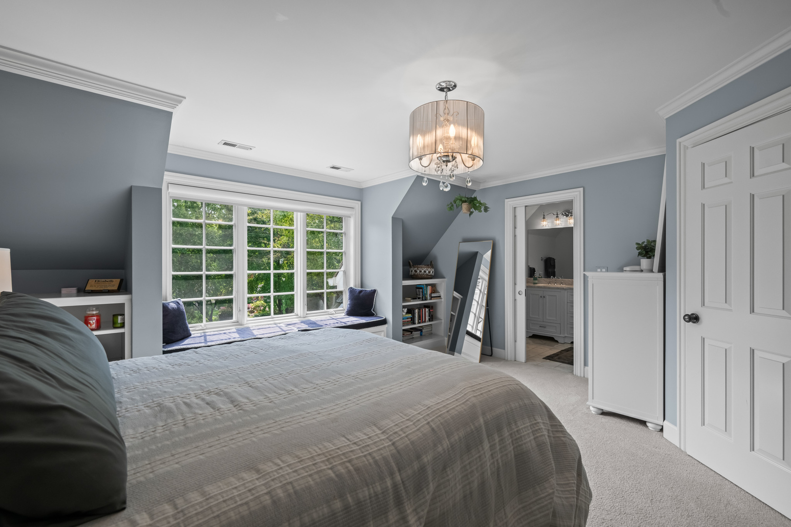 35 Riderwood Road North Barrington, IL 60010 - Photo 23 of 59 a large bedroom with a bed and a large window