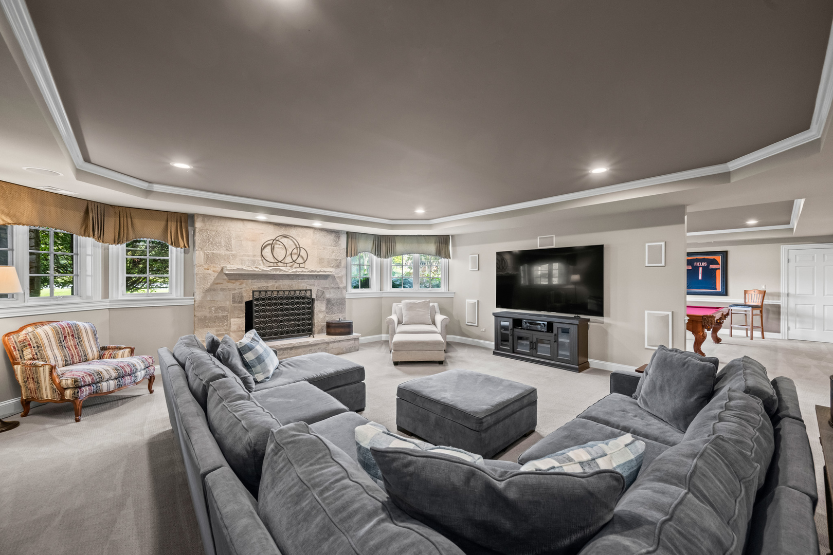 35 Riderwood Road North Barrington, IL 60010 - Photo 36 of 59 a living room with furniture a fireplace and a flat screen tv