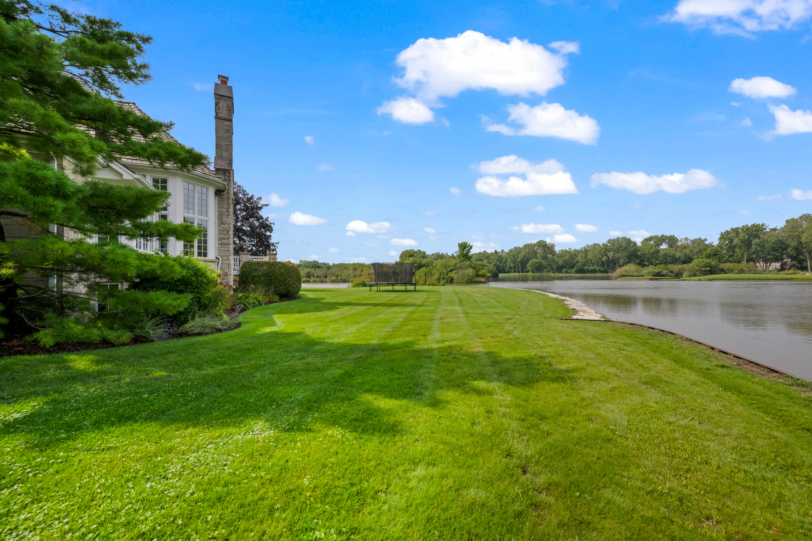 35 Riderwood Road North Barrington, IL 60010 - Photo 48 of 59 a view of a lake with a big yard