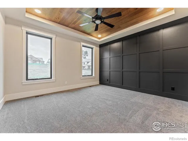 a open kitchen with cabinets and wooden floor