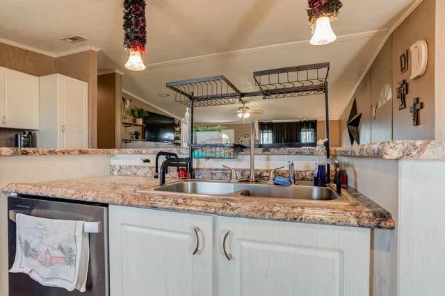 a kitchen with stainless steel appliances granite countertop a stove and a microwave
