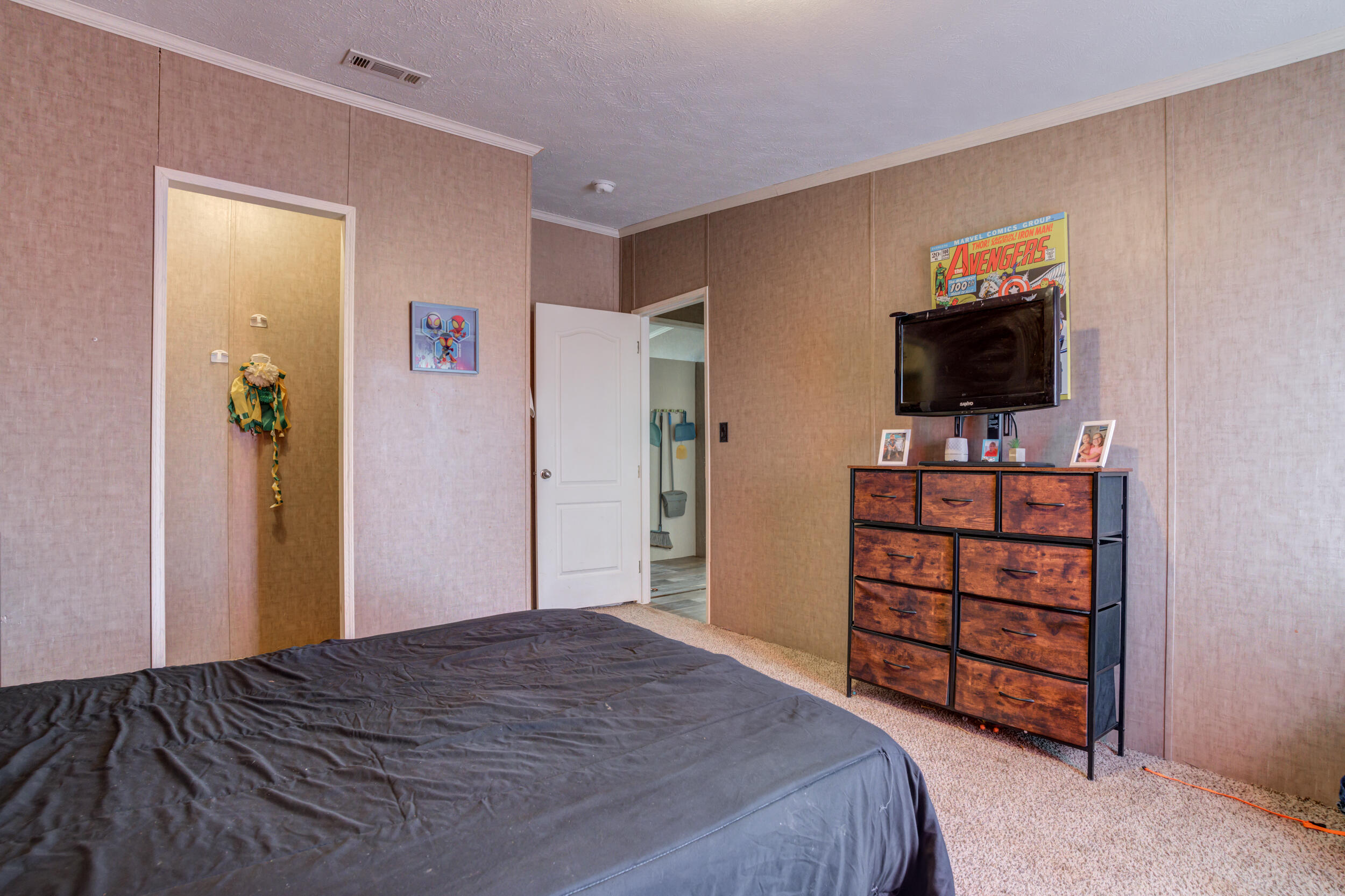 4726 County Road 5300 Lubbock, TX 79415 - Photo 38 of 53 a bedroom with a bed and a flat screen tv