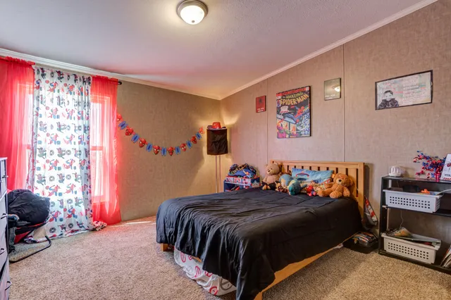 a bedroom with furniture and a bed