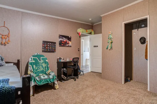 a bathroom with a granite countertop sink double vanity and a mirror