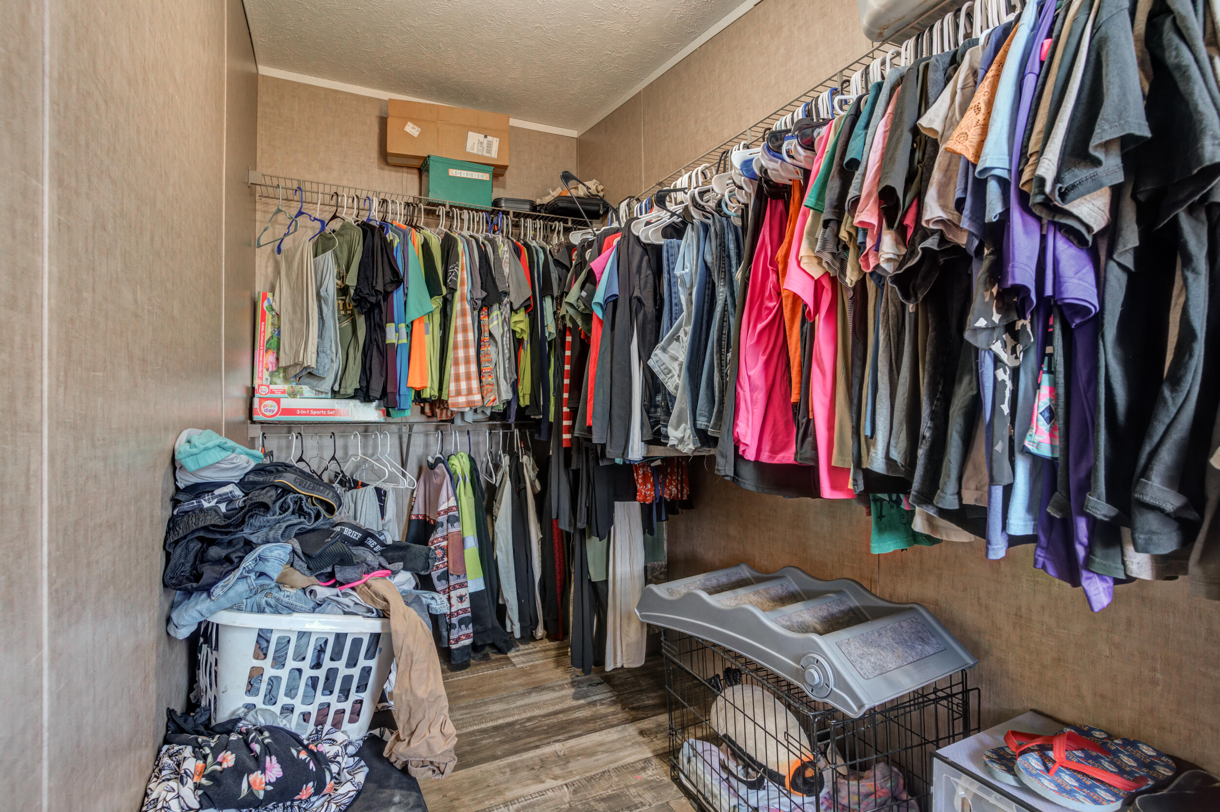 4726 County Road 5300 Lubbock, TX 79415 - Photo 46 of 53 a view of walk in closet with clothes