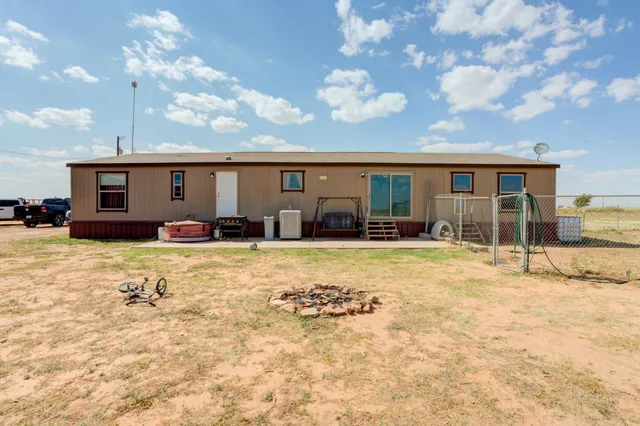 a view of a swimming pool with an outdoor seating