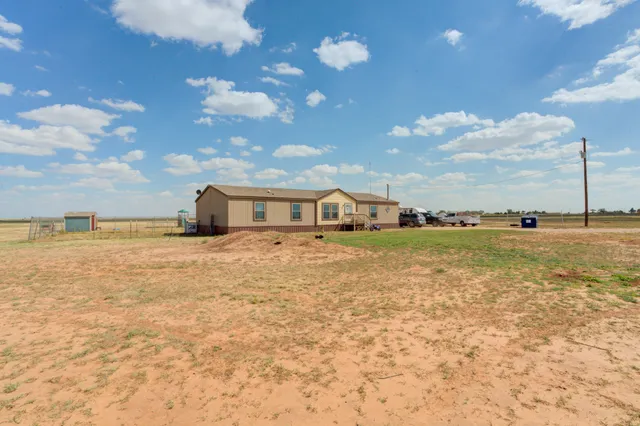a view of kitchen with cabinets and flat screen tv