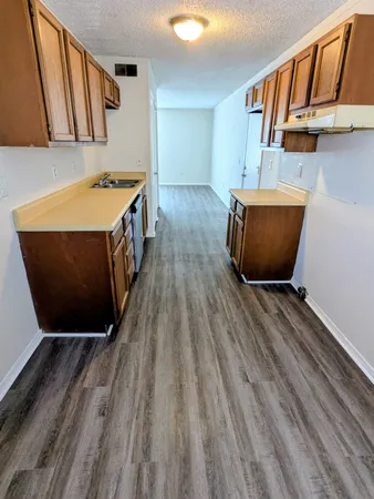 a view of a room with wooden floor and stairs