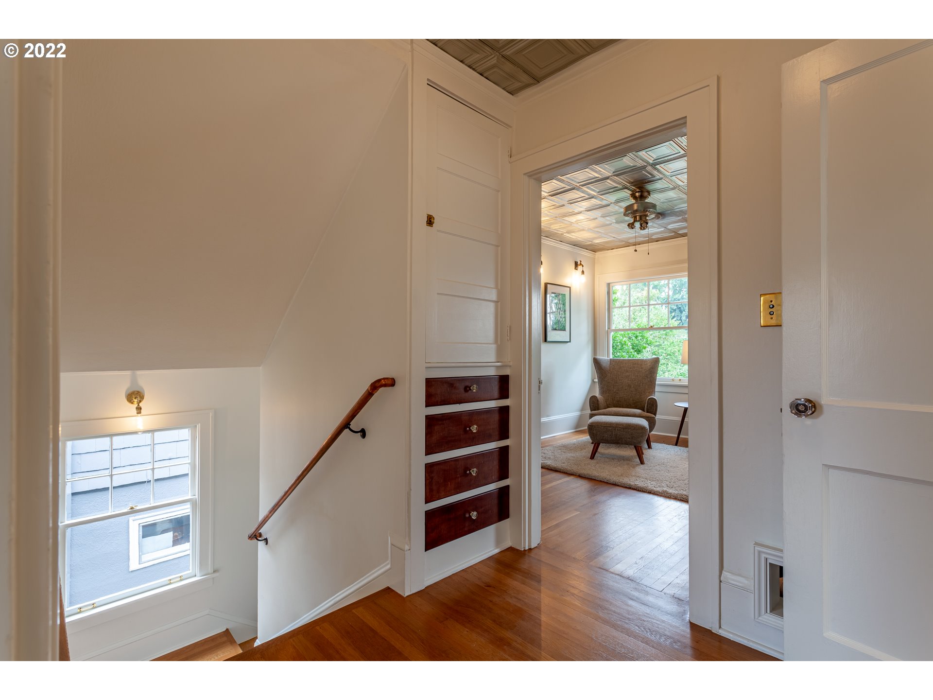 3345 Northeast Holladay Street Portland, OR 97232 - Photo 18 of 32 a view of a hallway with furniture and a window