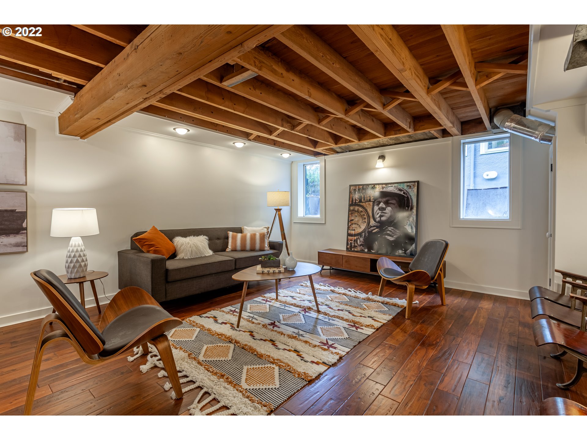 3345 Northeast Holladay Street Portland, OR 97232 - Photo 20 of 32 a living room with furniture and a wooden floor