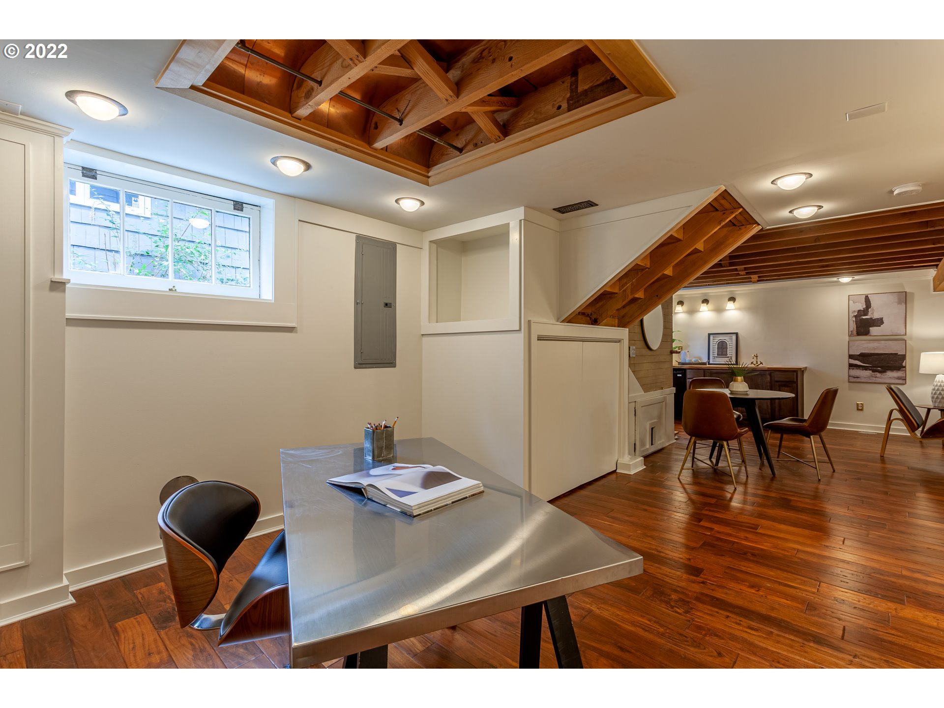 3345 Northeast Holladay Street Portland, OR 97232 - Photo 25 of 32 a workspace with furniture and wooden floor
