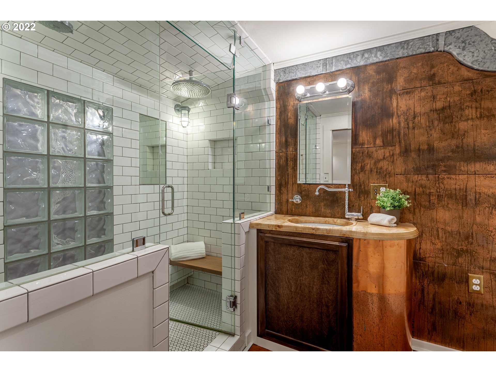 3345 Northeast Holladay Street Portland, OR 97232 - Photo 28 of 32 a bathroom with a sink a toilet and shower