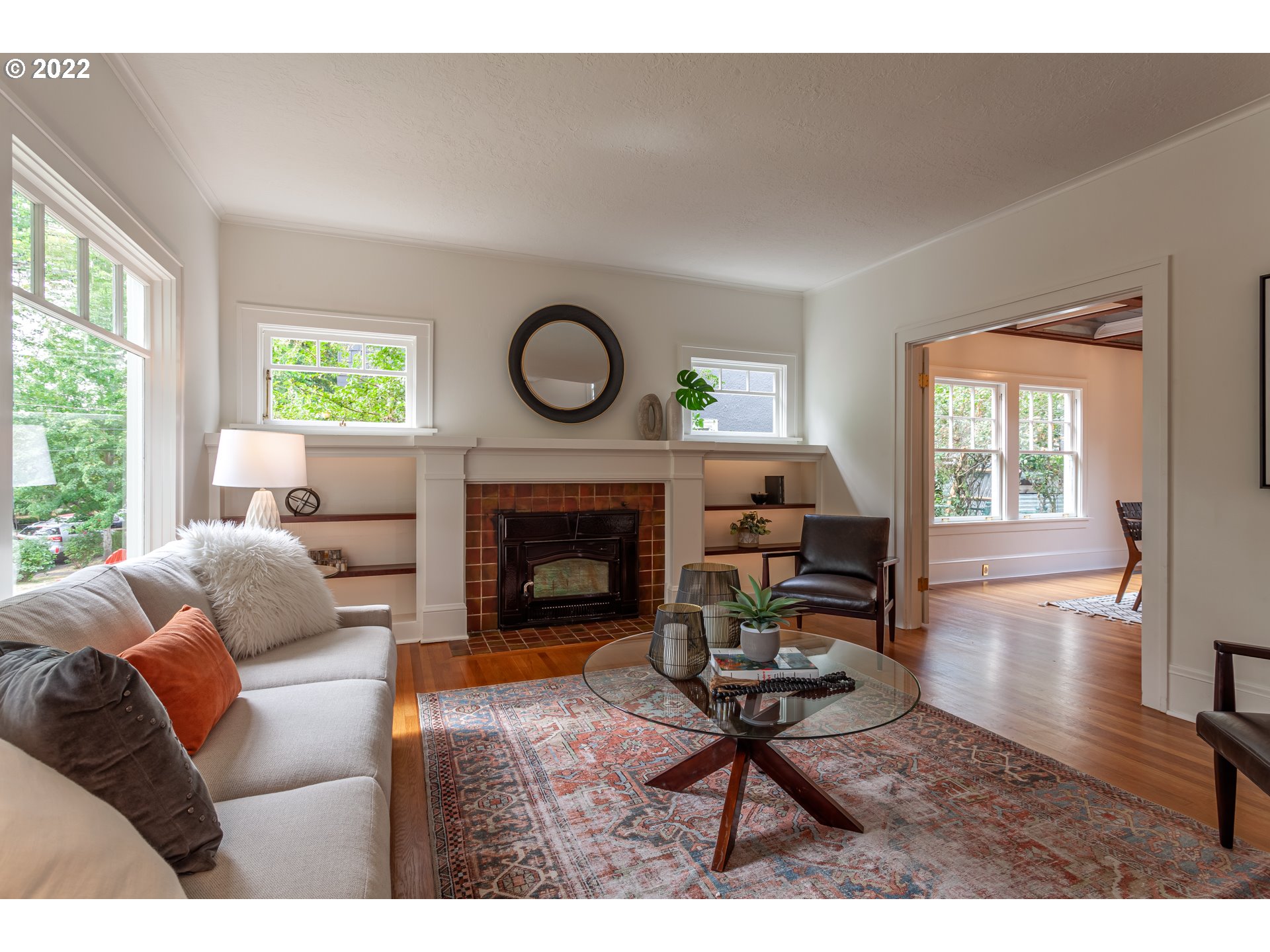 3345 Northeast Holladay Street Portland, OR 97232 - Photo 3 of 32 a living room with furniture a fireplace and window