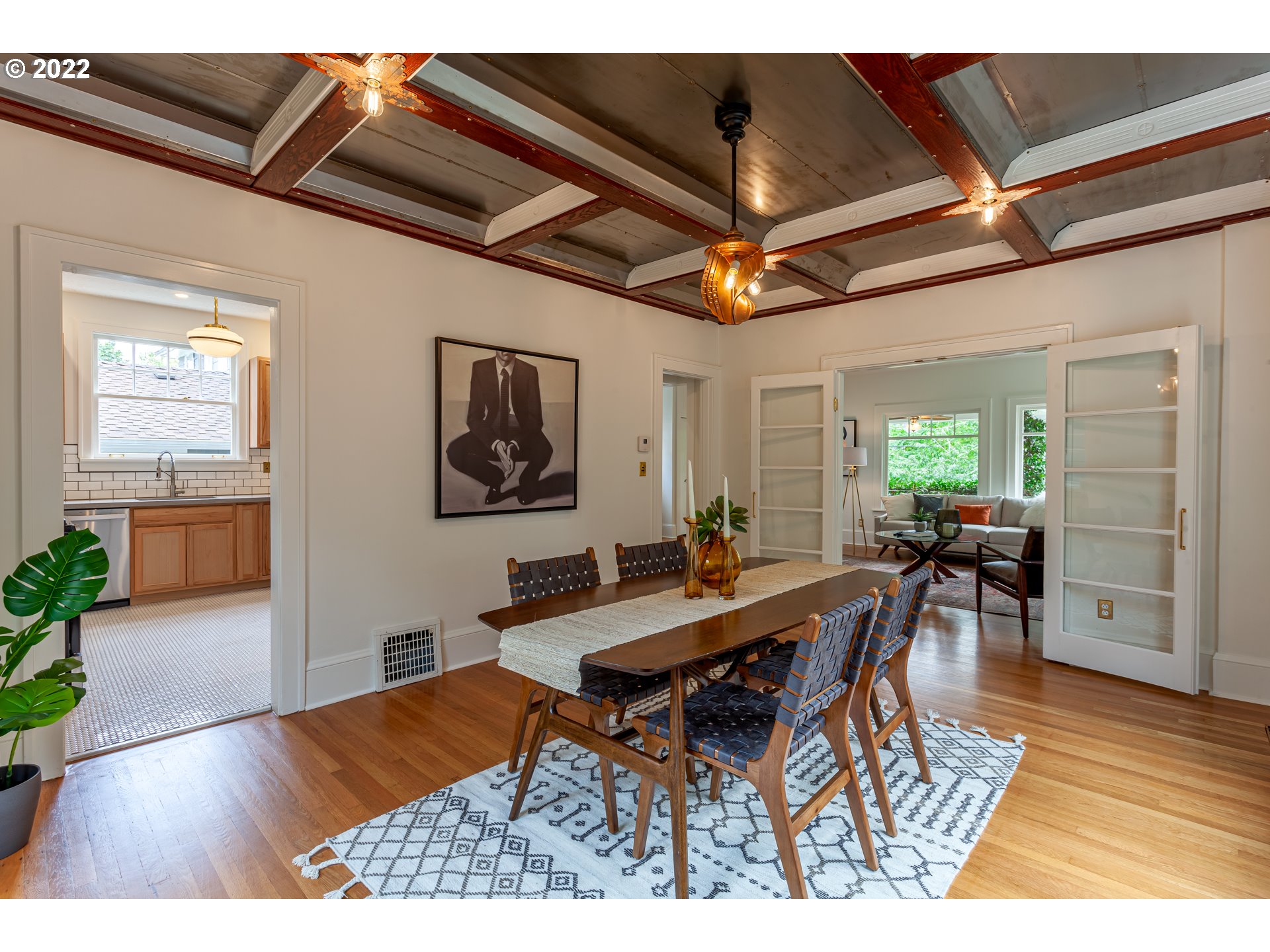 3345 Northeast Holladay Street Portland, OR 97232 - Photo 5 of 32 a view of a dining room with furniture and wooden floor