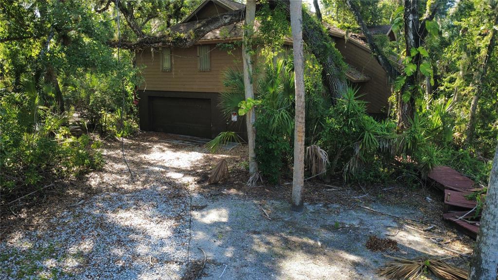 4632 Stone Ridge Trail Sarasota, FL 34232 - Photo 11 of 15 a backyard of a house with lots of green space