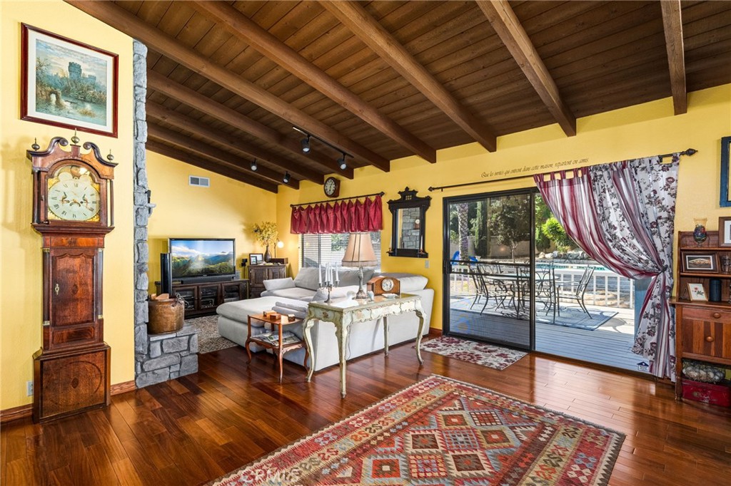 2421 Cliff Road Upland, CA 91784 - Photo 11 of 45 a living room with furniture a rug and a floor to ceiling window