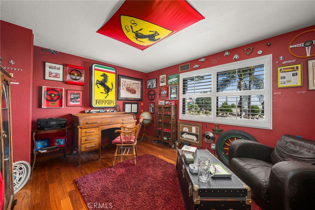 2421 Cliff Road Upland, CA 91784 - Photo 20 of 45 a living room with furniture a piano and a bookshelf