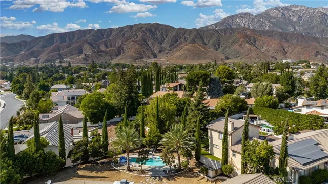 an aerial view of a residential apartment building with a yard