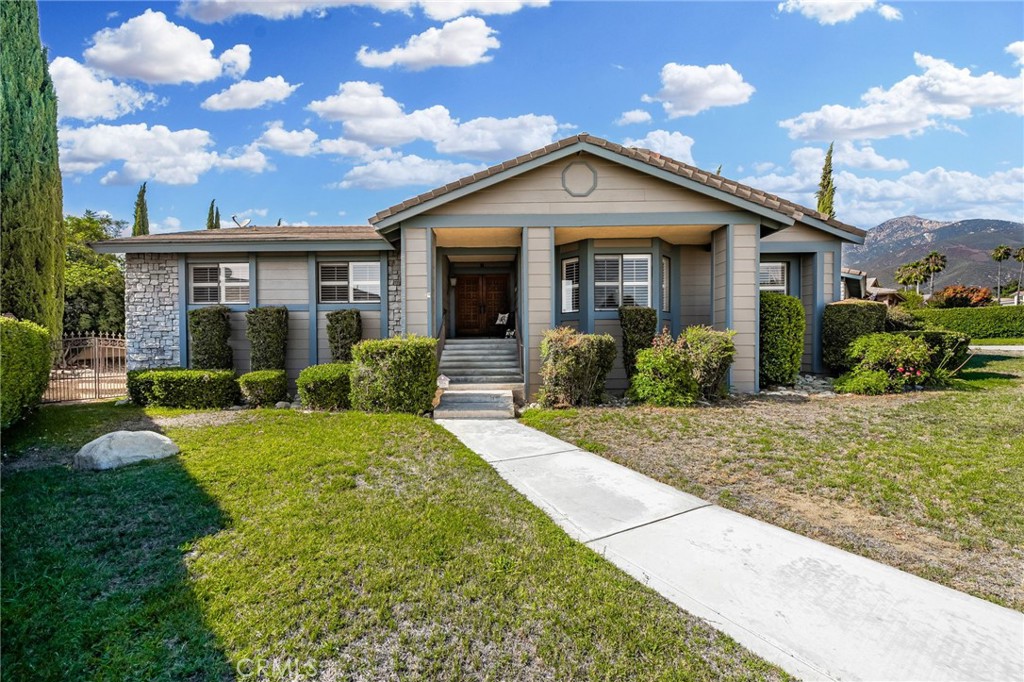 2421 Cliff Road Upland, CA 91784 - Photo 6 of 45 a front view of a house with garden