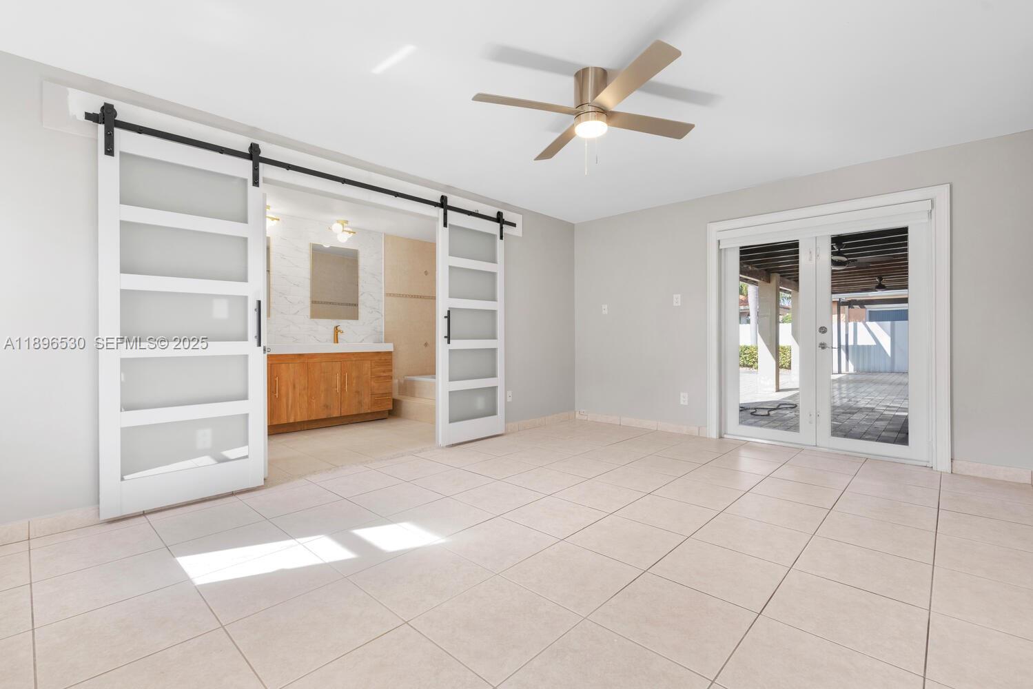 14020 Southwest 38th Street Miami, FL 33175 - Photo 12 of 21 a view of empty room with cabinet and fan