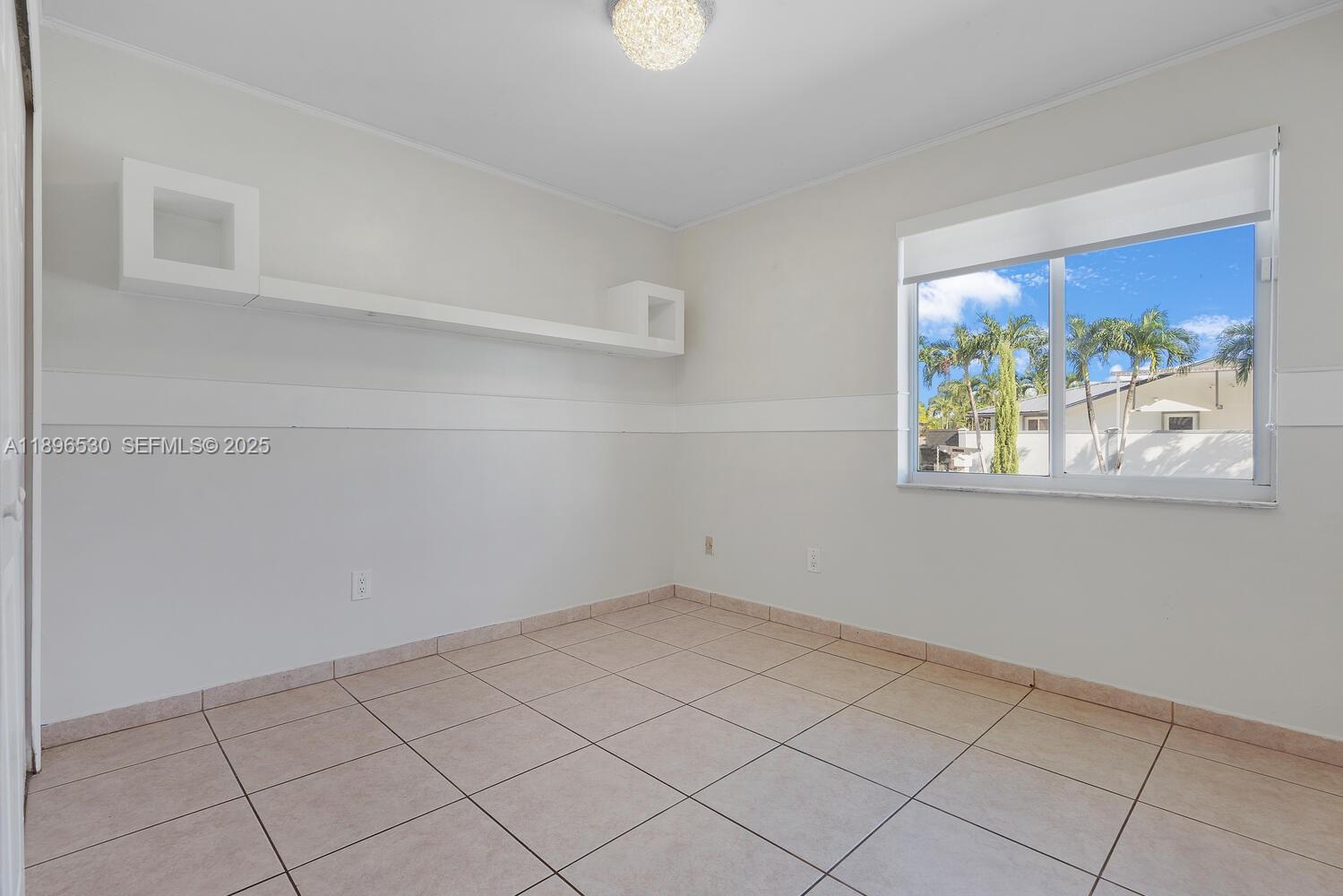 14020 Southwest 38th Street Miami, FL 33175 - Photo 14 of 21 a view of an empty room
