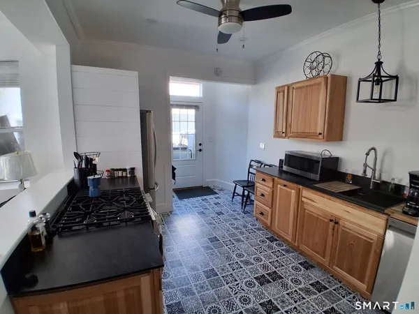 a kitchen with sink and window