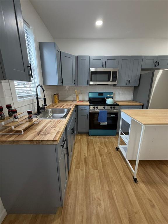 814 Oak Street Johnstown, PA 15902 - Photo 18 of 33 a kitchen with a sink a counter top space stainless steel appliances and cabinets