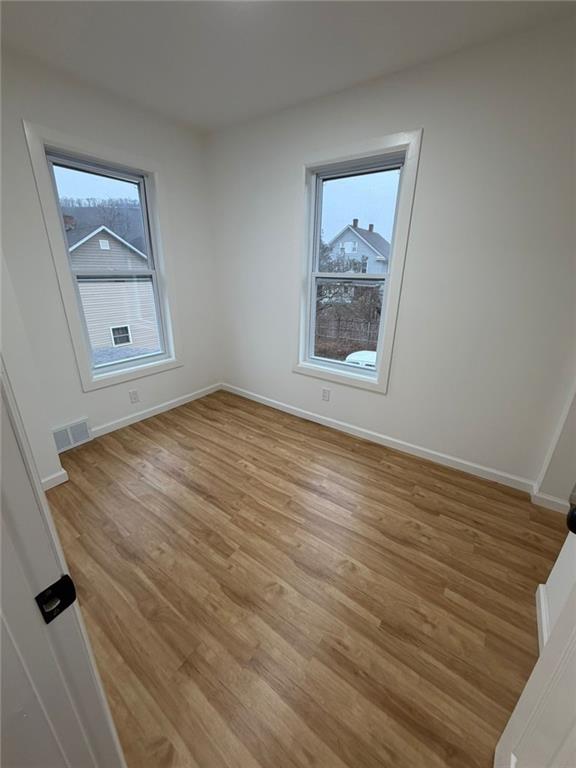 814 Oak Street Johnstown, PA 15902 - Photo 28 of 33 a view of an empty room with wooden floor and a window