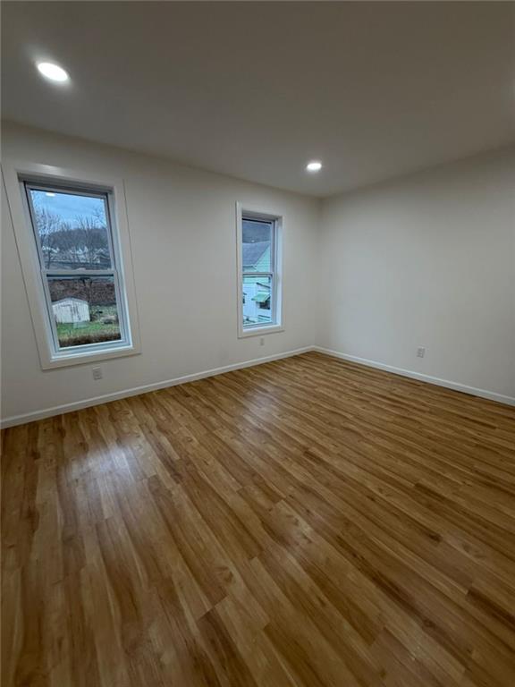 814 Oak Street Johnstown, PA 15902 - Photo 31 of 33 an empty room with wooden floor and windows