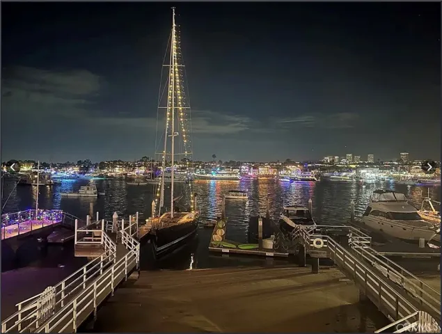 a balcony with chairs and city view