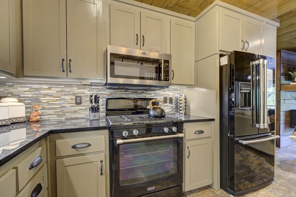 2263 Dial Road Blue Ridge, GA 30513 - Photo 28 of 53 a kitchen with stainless steel appliances granite countertop a refrigerator stove and sink