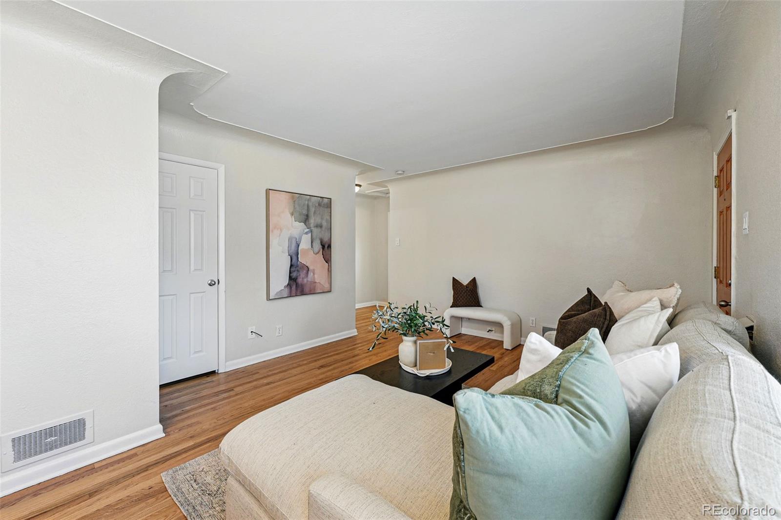 1632 Ulster Street Denver, CO 80220 - Photo 6 of 26 a living room with furniture and wooden floor