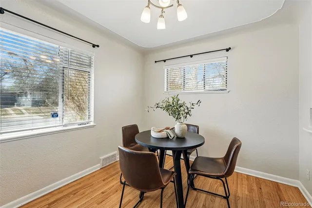 a dining room with furniture and window