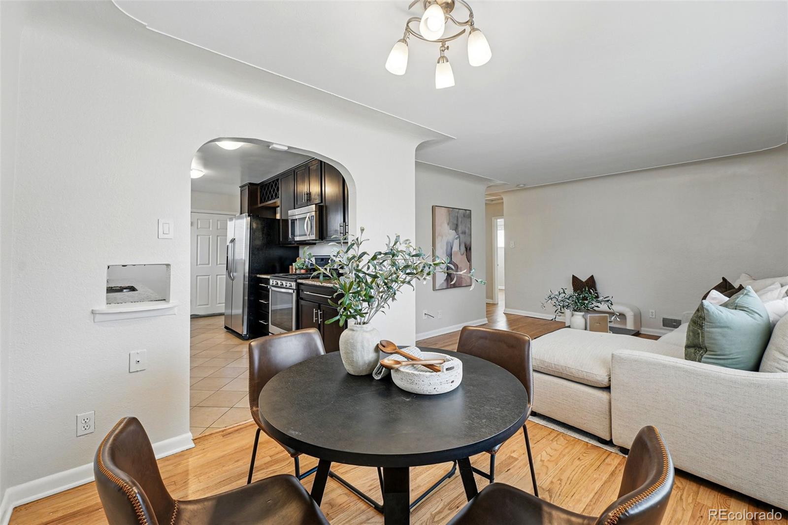 1632 Ulster Street Denver, CO 80220 - Photo 9 of 26 a view of a dining room with furniture and wooden floor