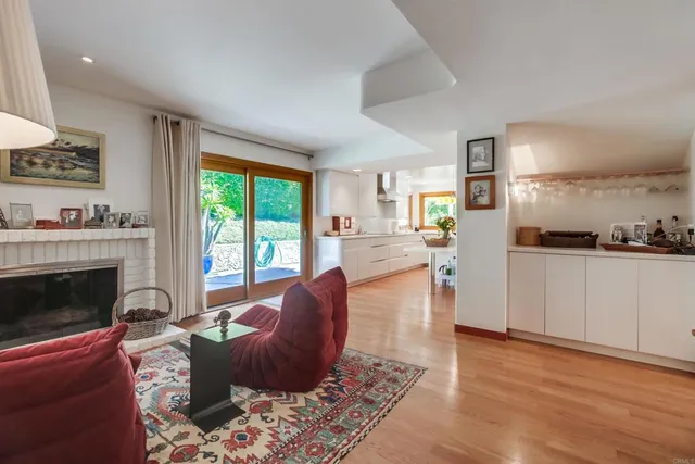 a kitchen that has a sink and a stove in it