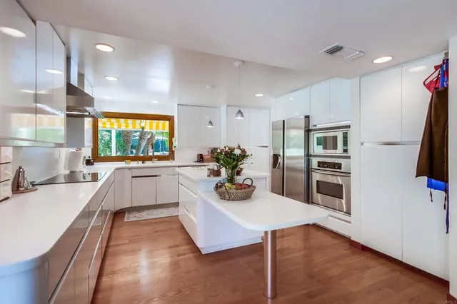 a view of a livingroom with furniture and a window