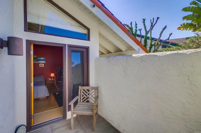 a white bath tub sitting in a bathroom next to a window