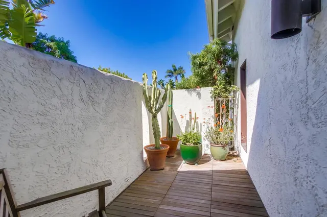 a bath tub sitting in a window next to a window