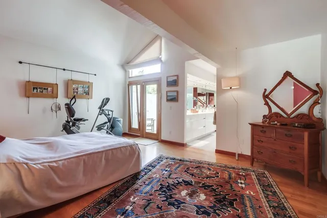 a view of a livingroom with workspace and a window