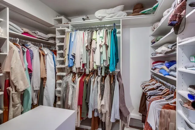 a living room with furniture and a book shelf