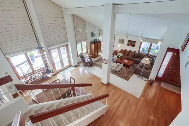 a bedroom with furniture and a window