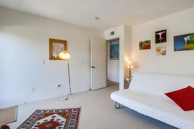 a view of an outdoor space with a table and chairs