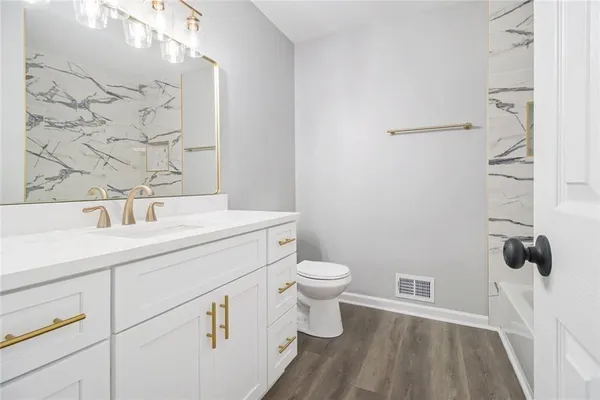 a bathroom with a sink and a toilet
