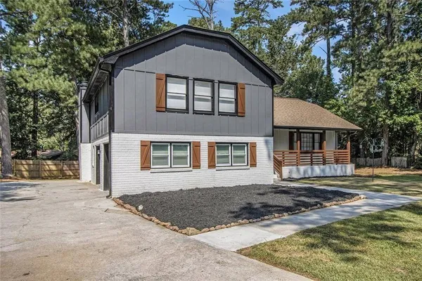 a front view of a house with a yard