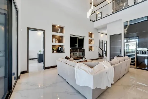 a kitchen with stainless steel appliances granite countertop a sink and a stove top oven with wooden floor