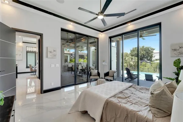 a bathroom with a glass shower door and a glass door