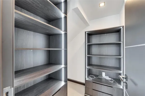 a bathroom with a sink a large mirror and shower