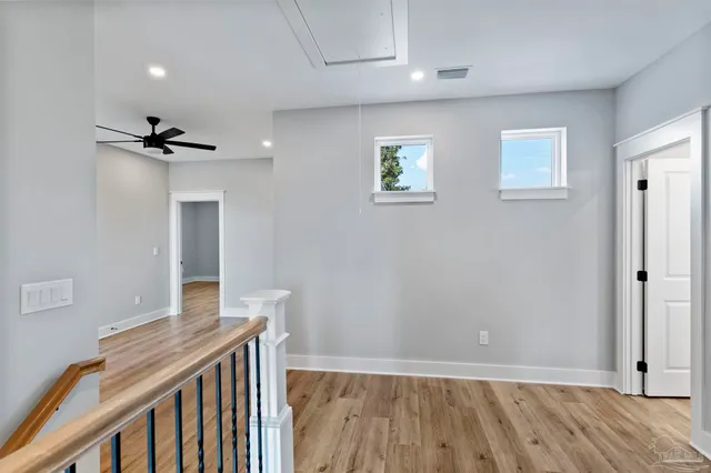 a view of a hallway with a window