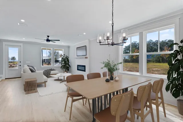 a view of a dining room with furniture window and outside view