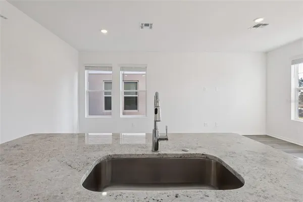 a kitchen with a sink and a window